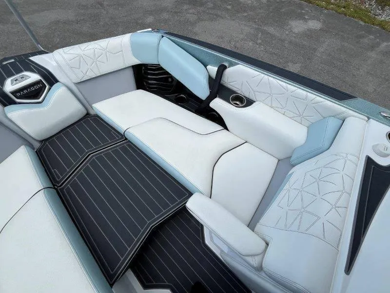 Slide: The Image of Luxurious interior of 2020 Nautique Paragon P25 boat with stylish seating and detailing. - 37