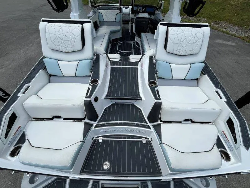 Slide: The Image of Luxurious interior of 2020 Nautique Paragon P25 boat with plush seating and sleek design. - 38