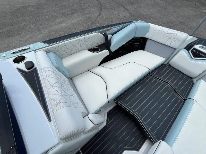 Slide: The Image of 2020 Nautique Paragon P25 boat interior with luxurious white seating and sleek design. - 39
