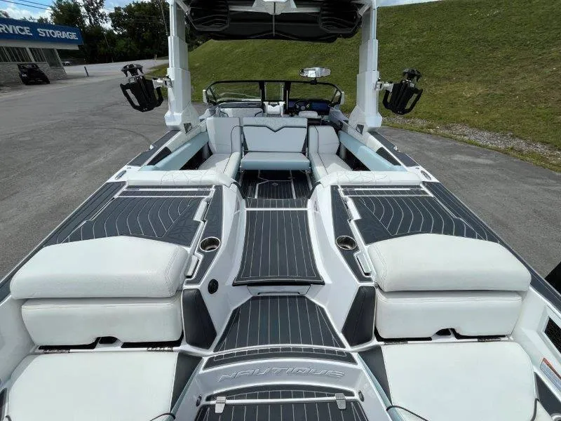 Slide: The Image of 2020 Nautique Paragon P25 boat interior with sleek seating and modern design. - 44