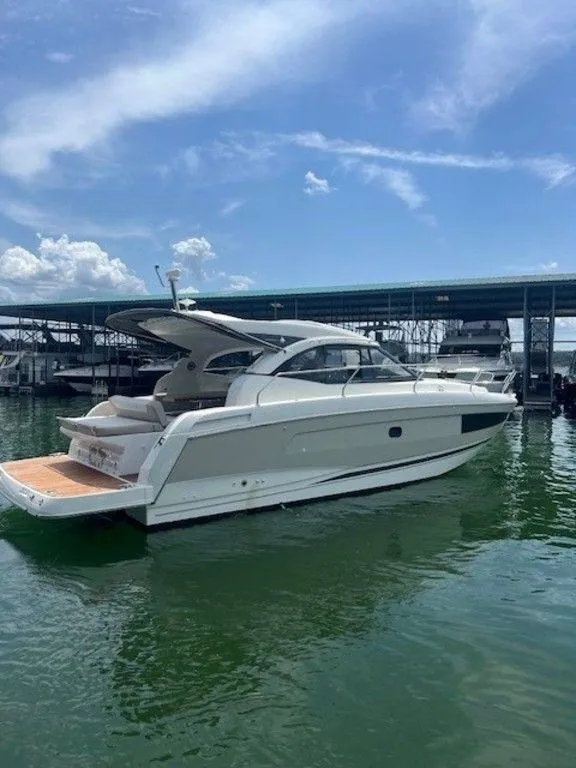 Slide: The Image of 2017 Jeanneau LEADER 36 yacht with covered deck, docked in marina. - 10