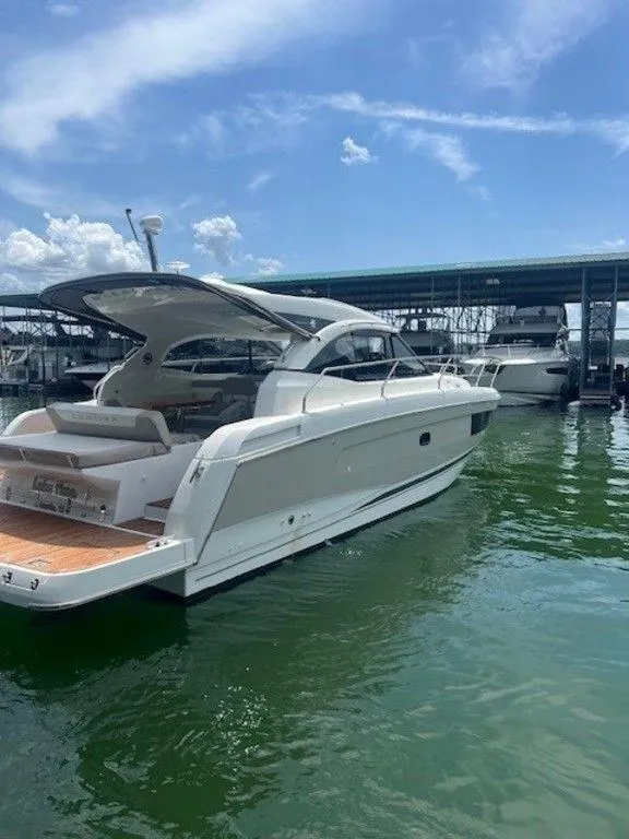 Slide: The Image of 2017 Jeanneau LEADER 36 yacht with covered deck in marina. - 11