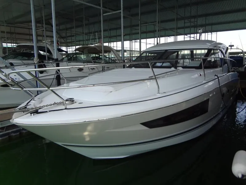 Slide: The Image of 2017 Jeanneau LEADER 36 boat interior with cushioned seating and table. - 15