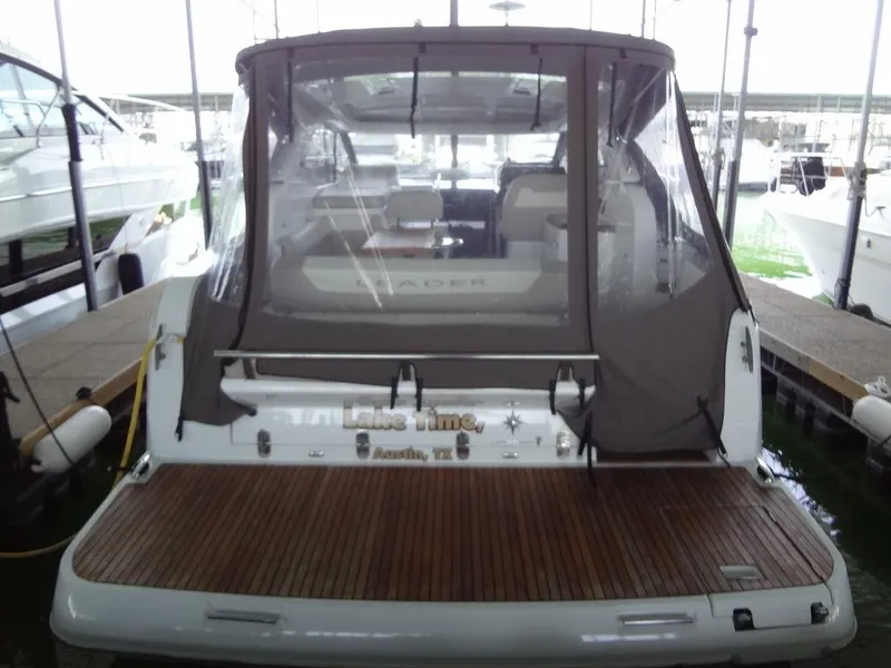 Slide: The Image of Jeanneau LEADER 36 yacht interior, 2017 model, featuring a wooden table and cushioned seating. - 17
