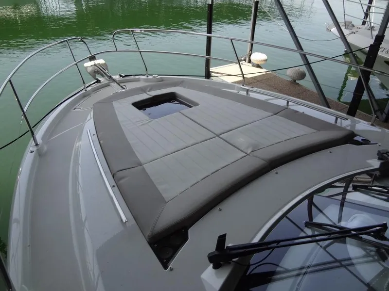 Slide: The Image of Interior of 2017 Jeanneau LEADER 36 with foldable table and cushioned seating. - 37