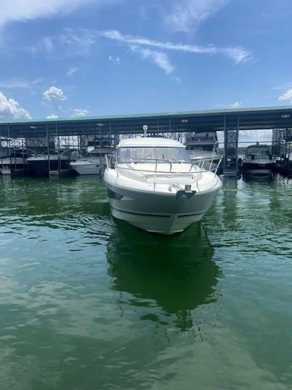 Slide: The Image of 2017 Jeanneau LEADER 36 boat on a lake, rear view with clear skies. - 4