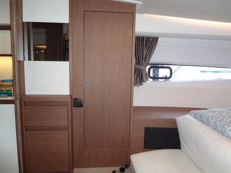 Slide: The Image of 2017 Jeanneau Leader 36 cabin interior with beige seating and wooden accents. - 49