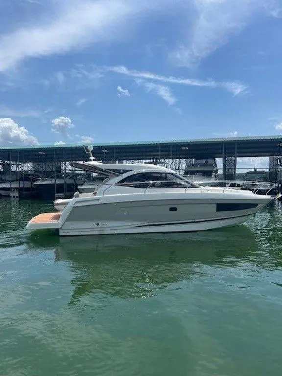 Slide: The Image of 2017 Jeanneau LEADER 36 yacht cruising on calm blue waters. - 7