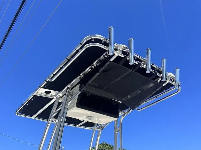 Slide: The Image of 2024 Key West 203 FS boat T-top against clear blue sky. - 10