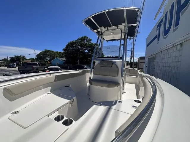 Slide: The Image of 2024 Key West 203 FS boat with T-top, spacious seating, and sleek design. - 11