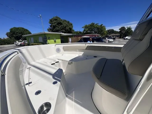 Slide: The Image of 2024 Key West 203 FS boat interior with seating and cup holders. - 12