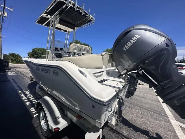 Slide: The Image of 2024 Key West 203 FS boat with Yamaha engine on a trailer. - 14