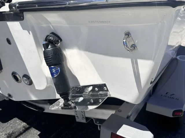 Slide: The Image of 2024 Key West 203 FS boat transom with trim tab and trailer. - 16