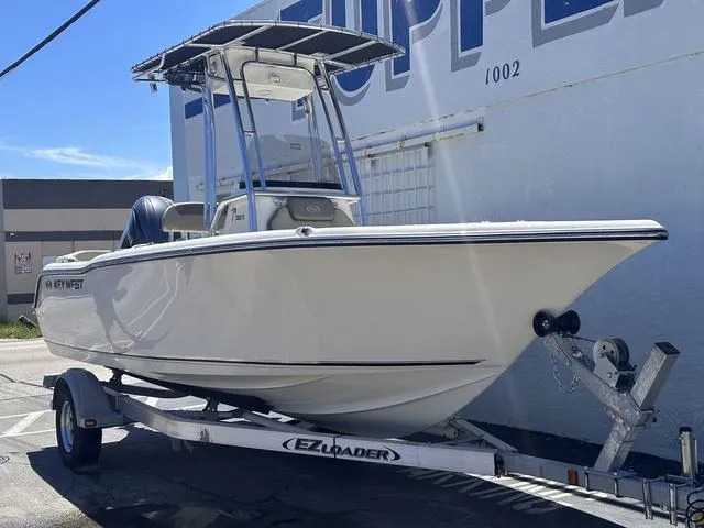 Slide: The Image of 2024 Key West 203 FS boat on trailer, parked outdoors. - 18