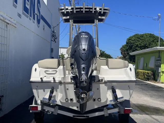 Slide: The Image of 2024 Key West 203 FS boat with 150 HP engine, parked outdoors. - 4