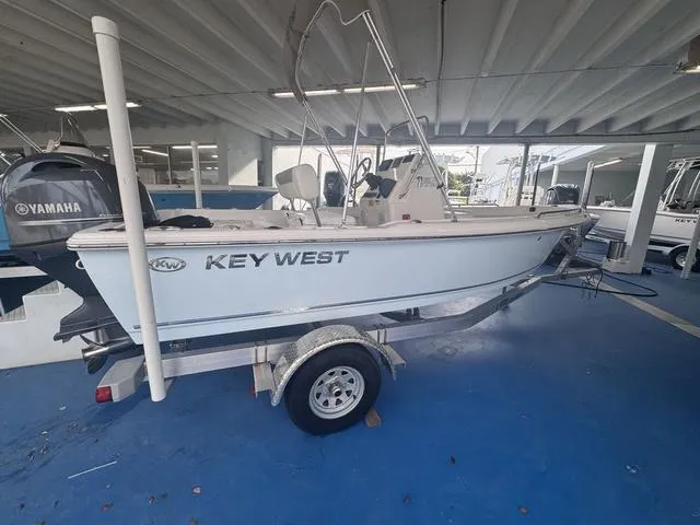 Slide: The Image of 2024 Key West 1720 CC boat interior with steering console and seating. - 4
