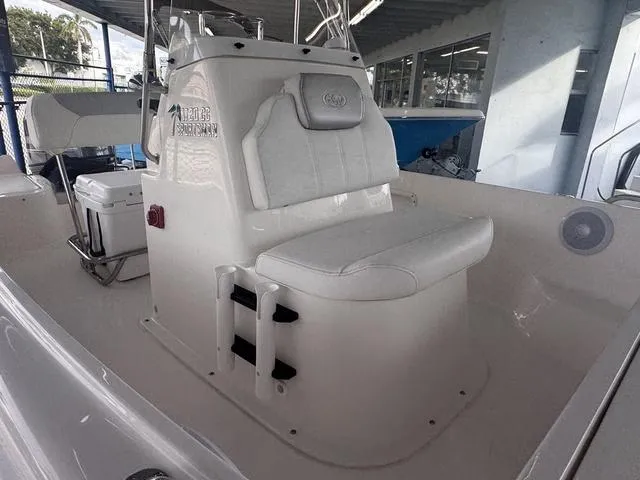 Slide: The Image of 2024 Key West 1720 CC boat parked near a building and car. - 9