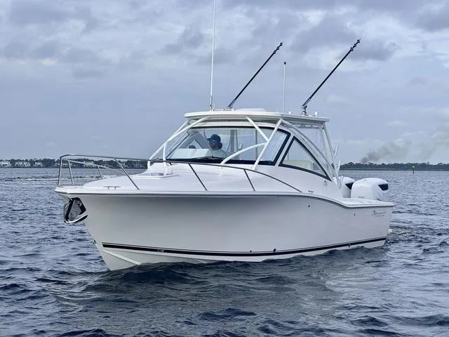 Slide: The Image of 2025 Albemarle 30 Express boat cruising on open water. - 10