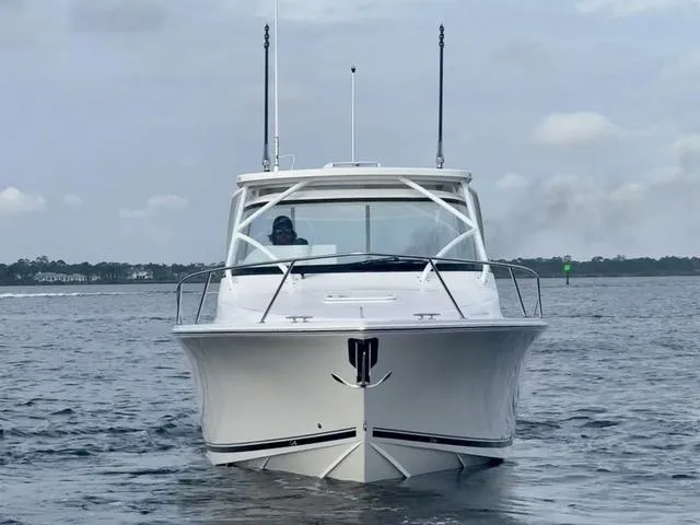 Slide: The Image of 2025 Albemarle 30 Express boat on calm water, front view. - 11