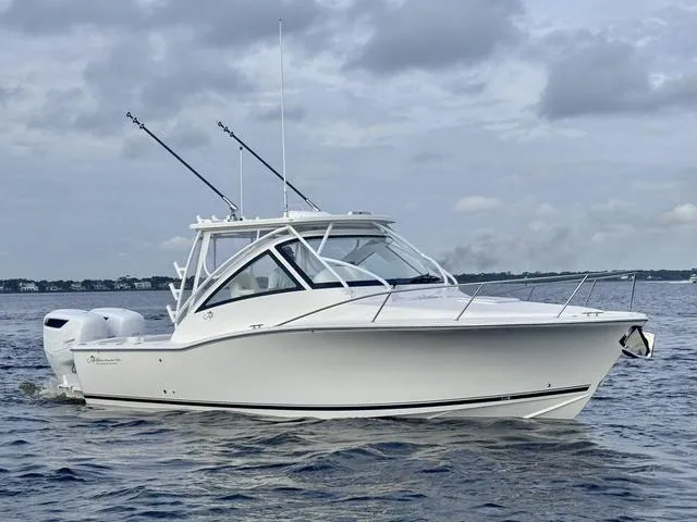 Slide: The Image of 2025 Albemarle 30 Express boat on open water under cloudy sky. - 12