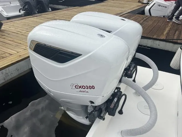 Slide: The Image of 2025 Albemarle 30 Express with twin CXO300 diesel outboard engines at dock. - 13