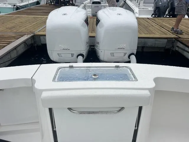 Slide: The Image of 2025 Albemarle 30 Express boat with twin outboard engines at dock. - 14