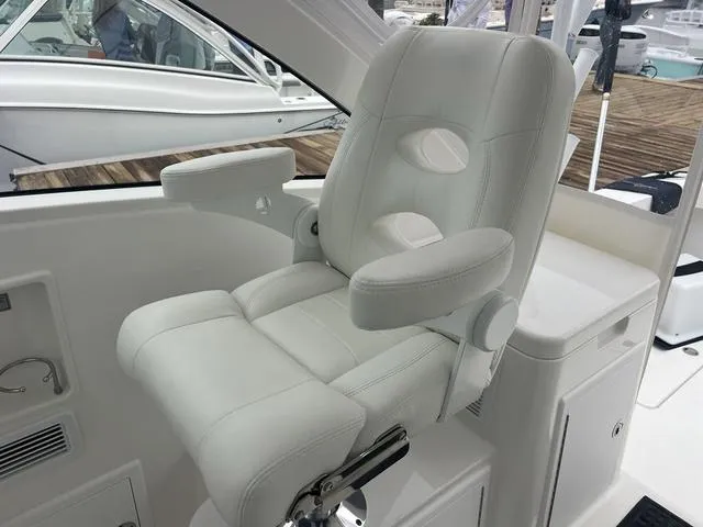 Slide: The Image of Luxurious white captain's chair on 2025 Albemarle 30 Express boat. - 18