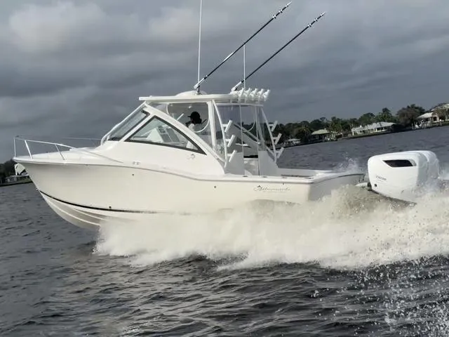 Slide: The Image of 2025 Albemarle 30 Express boat cruising on water with fishing rods. - 24