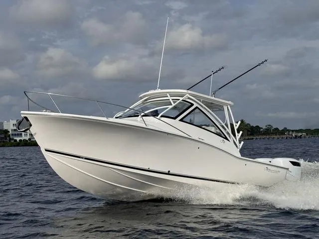 Slide: The Image of 2025 Albemarle 30 Express boat cruising on open water under cloudy skies. - 25