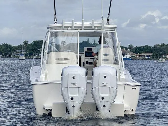 Slide: The Image of 2025 Albemarle 30 Express boat with dual outboard engines on the water. - 5