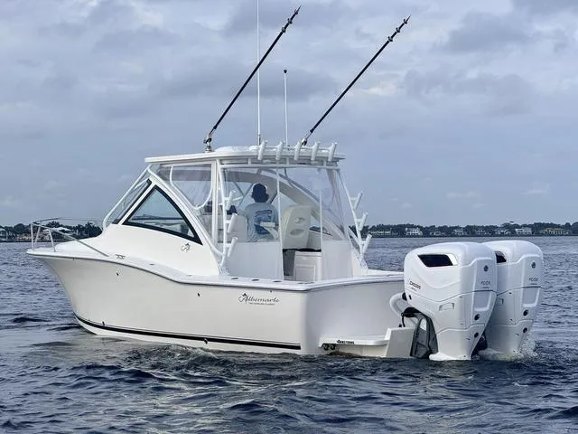 Slide: The Image of 2025 Albemarle 30 Express boat on water with dual outboard engines. - 7