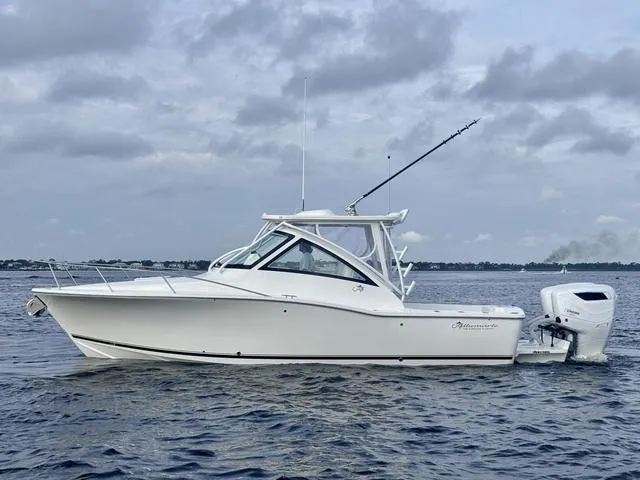 Slide: The Image of 2025 Albemarle 30 Express boat on calm water under cloudy sky. - 9