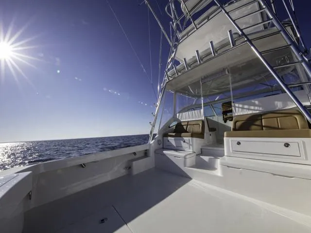 Slide: The Image of 2024 Albemarle 41 Express yacht on open sea under bright sun. - 10