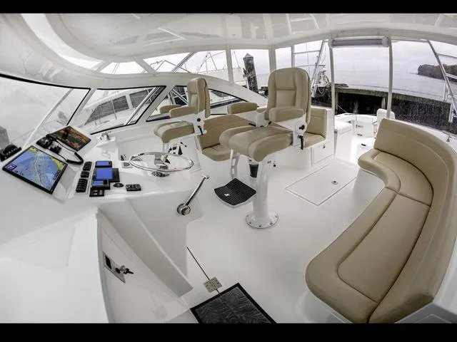 Slide: The Image of Luxurious 2024 Albemarle 41 Express yacht interior with modern helm and seating. - 13