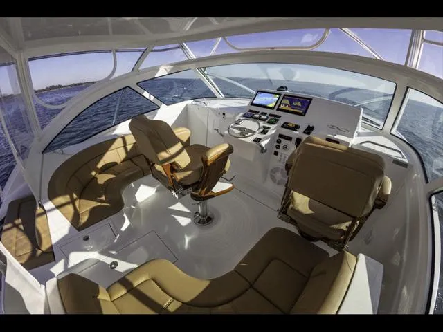 Slide: The Image of Luxurious 2024 Albemarle 41 Express yacht interior with modern navigation equipment and comfortable seating. - 17