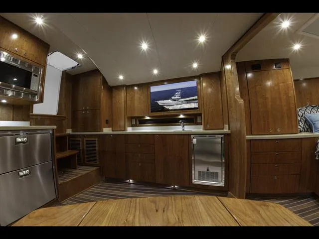 Slide: The Image of Luxurious interior of 2024 Albemarle 41 Express yacht with wood cabinetry and modern amenities. - 19