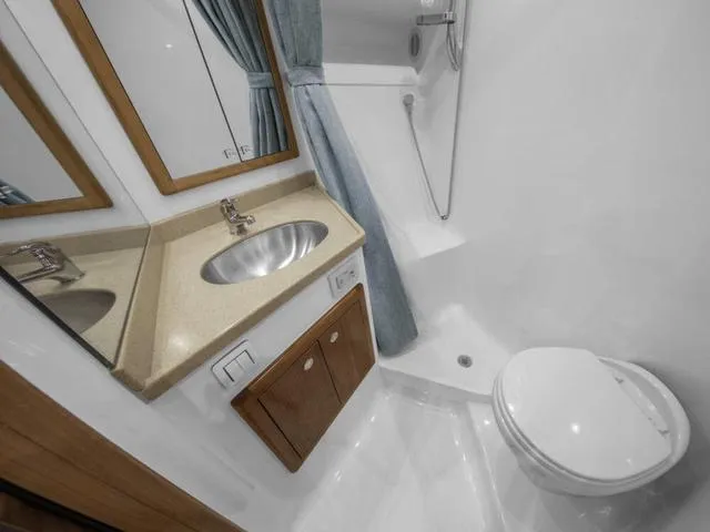 Slide: The Image of 2024 Albemarle 41 Express bathroom with sink, shower, and toilet. - 26