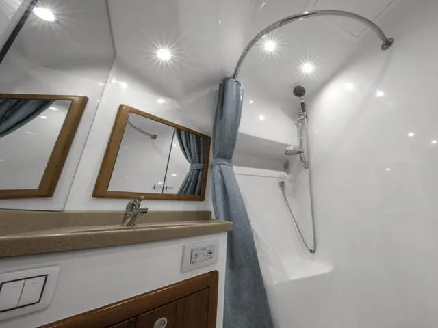 Slide: The Image of Luxurious bathroom in 2024 Albemarle 41 Express yacht with modern fixtures and elegant design. - 27