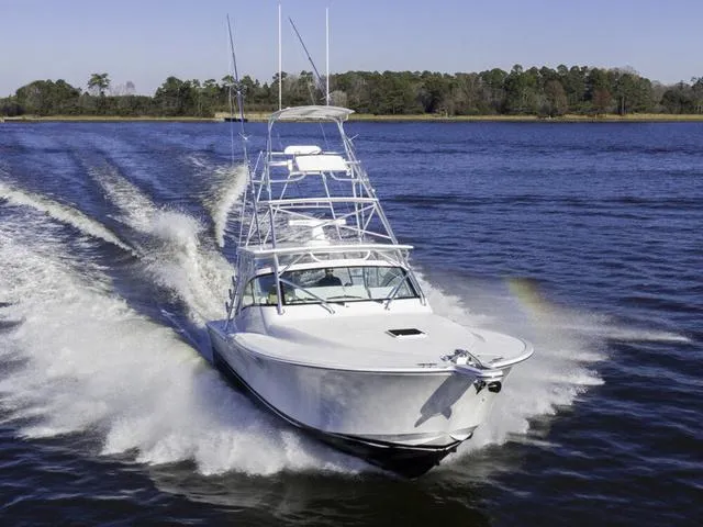 Slide: The Image of 2024 Albemarle 41 Express cruising on a scenic waterway. - 31