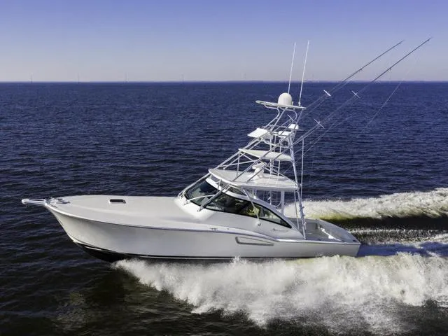 Slide: The Image of 2024 Albemarle 41 Express yacht cruising on open water. - 34