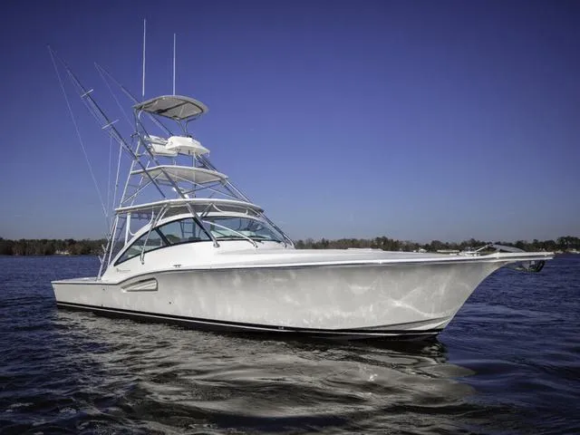 Slide: The Image of 2024 Albemarle 41 Express boat on calm water under clear blue sky. - 35