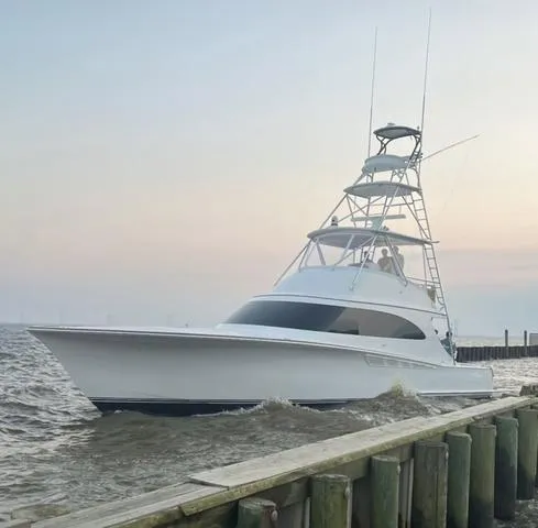 Slide: The Image of 2025 Albemarle 53 Spencer Edition yacht docked at sunset. - 1