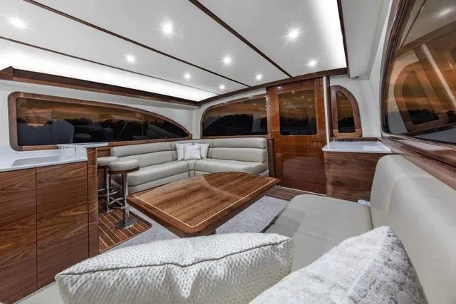Slide: The Image of Luxurious interior of 2025 Albemarle 53 Spencer Edition yacht with elegant wood finishes. - 4