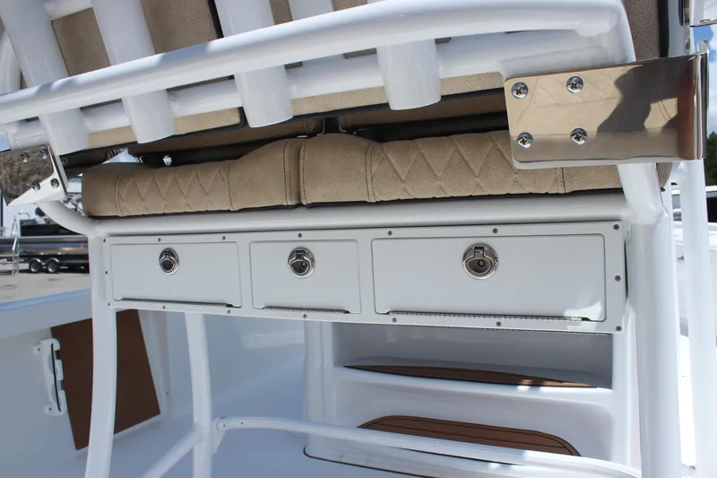 Slide: The Image of 2025 Sea Pro 250 Bay boat storage drawers and seating detail. - 13