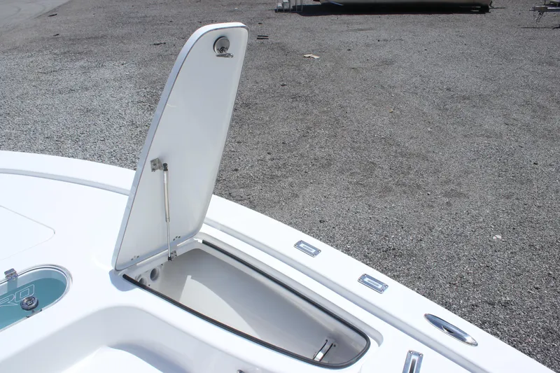 Slide: The Image of 2025 Sea Pro 250 Bay boat storage compartment open on deck. - 25