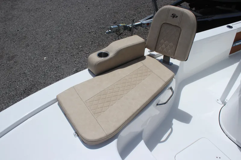 Slide: The Image of 2025 Sea Pro 250 Bay boat seat with beige upholstery and cup holder. - 26