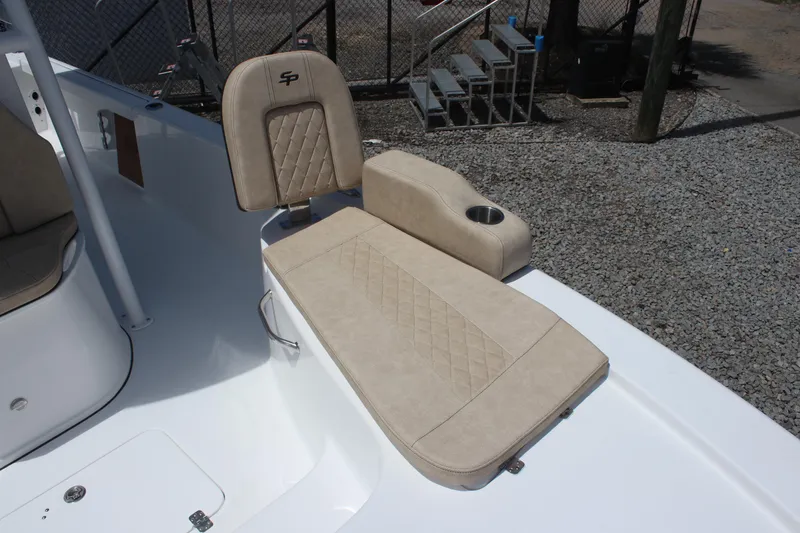 Slide: The Image of 2025 Sea Pro 250 Bay boat seat with beige upholstery and cup holder. - 27