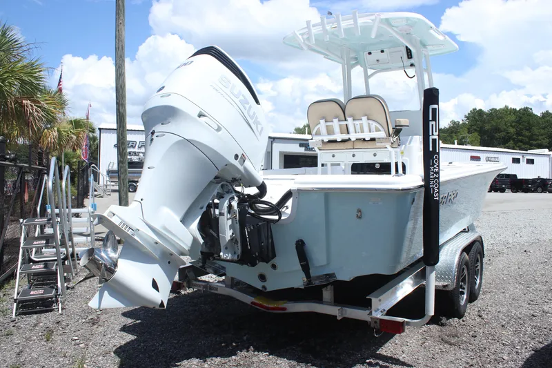 Slide: The Image of 2025 Sea Pro 250 Bay boat on trailer, featuring powerful outboard motor. - 5