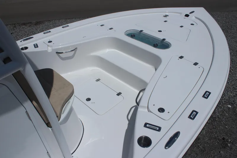Slide: The Image of 2025 Sea Pro 250 Bay boat deck with seating and storage compartments. - 6