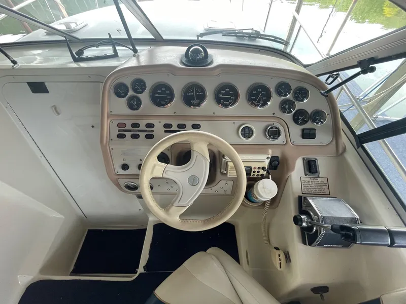 Slide: The Image of 1998 Rinker Fiesta Vee 280 boat dashboard with steering wheel and instrument panel. - 6